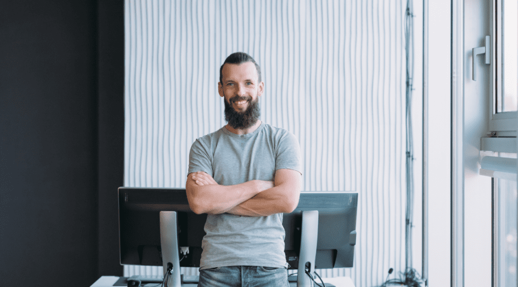 Man standing in front of computers